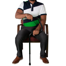 Load image into Gallery viewer, Individual Sitting in Chair Holding Easy Riser Cane
